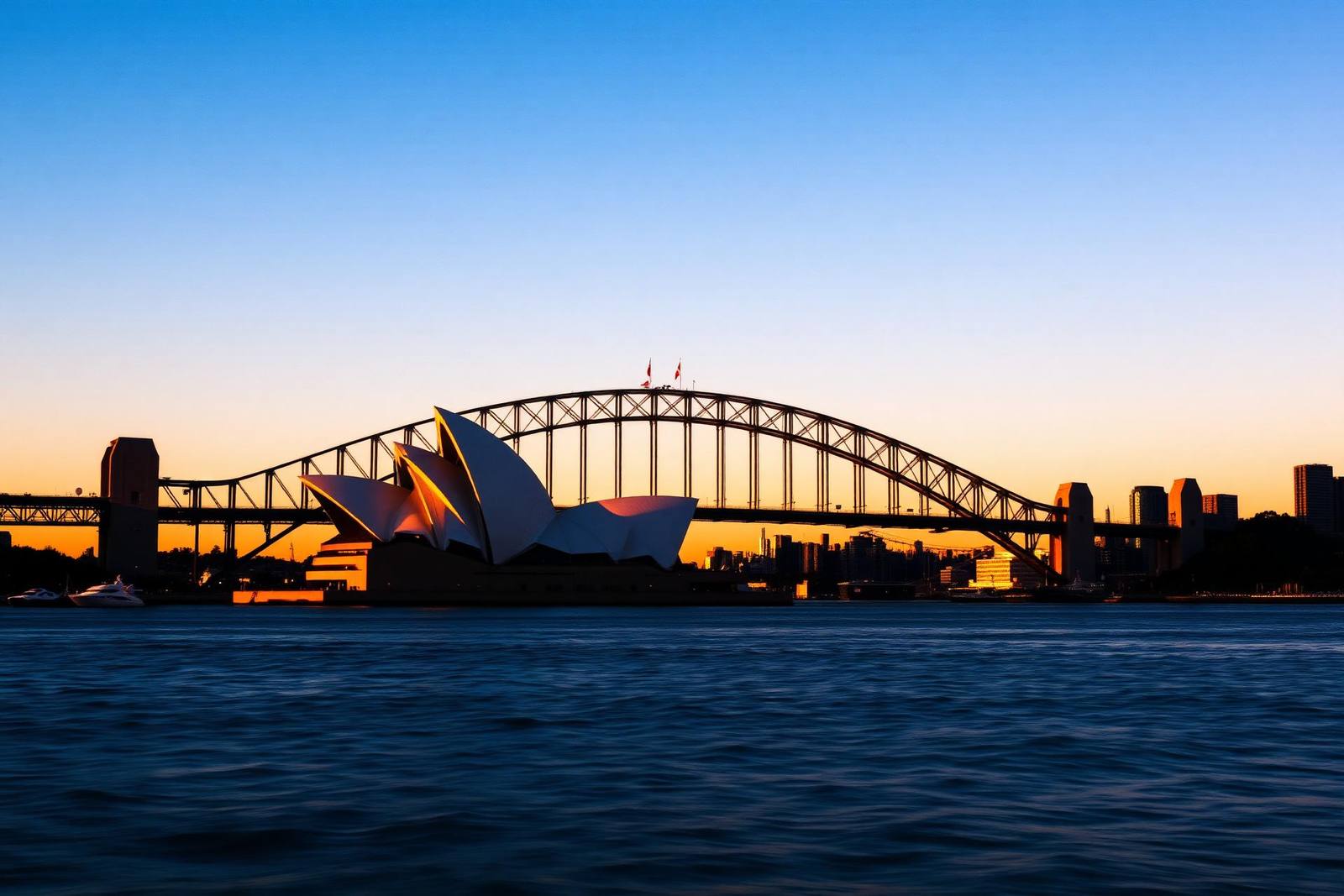 Sydney Harbour Bridge and Opera House at sunset